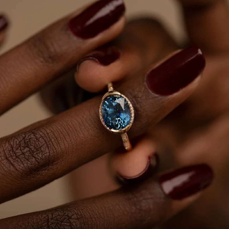 Best Jewelry Deals – Premium Quality At Exclusive Discounts Oval Sapphire Engagement Ring with a Brilliant Diamond Belt